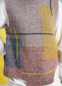 Close-up of a knitted vest featuring abstract patterns in muted pink, blue, and yellow tones, over a white shirt. The background is pastel yellow.
