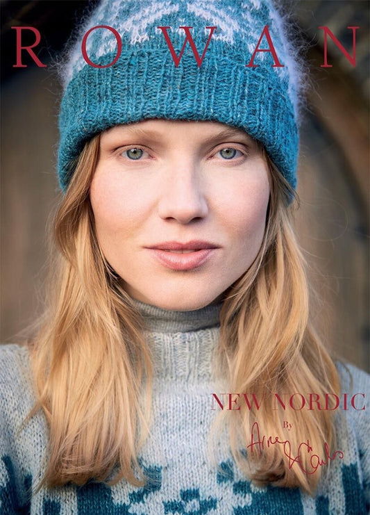 A woman in a blue knit hat and patterned sweater gazes directly at the camera. The text "ROWAN" and "NEW NORDIC" suggests a winter fashion theme.