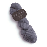 Grey Rowan wool yarn, 100% pure and responsibly sourced, highlighting its soft feel and 10ply worsted construction.