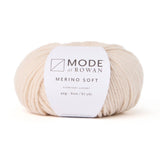 A ball of Rowan mode Merino Soft yarn in colour sand