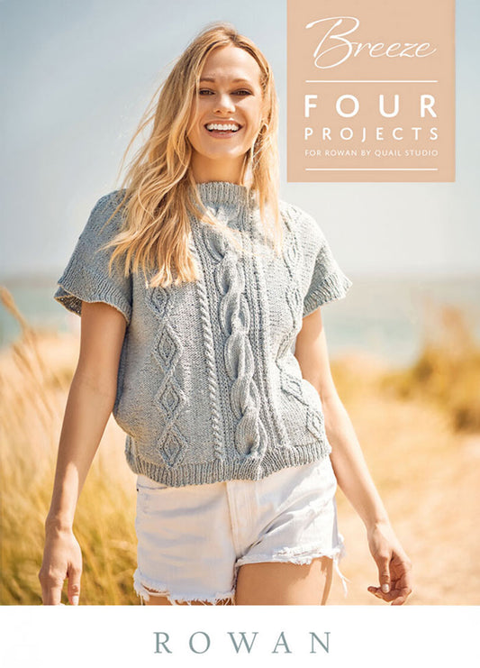 Smiling woman in a gray knitted top and white shorts stands on a sunny beach. Text reads "Breeze: Four Projects." She appears carefree and happy.