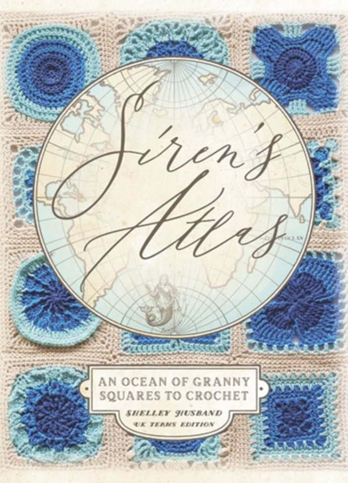 Cover of "Siren's Atlas" shows a vintage map with elegant script. Surrounding crochet granny squares in varying blues create a cozy, artistic feel.