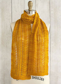 Sage Smudging Scarf on mannequin, hand-knit in mustard yellow with an intricate lace pattern.