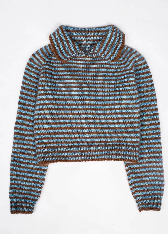 Striped knit sweater with wide collar in alternating blue and brown. The cozy texture and earthy tones create a warm and casual vibe.