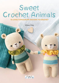 Cover of Sweet Crochet Animals by Khuc Cay, showing two crocheted bear dolls holding hands, dressed in striped sweaters with ruffled collars, lying on soft teal and white fabric.