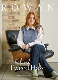 Woman with long red hair sits on a black chair, wearing a blue sweater vest and plaid pants. Background features a brick wall. Text reads "Rowan, Textured Tweed Haze."