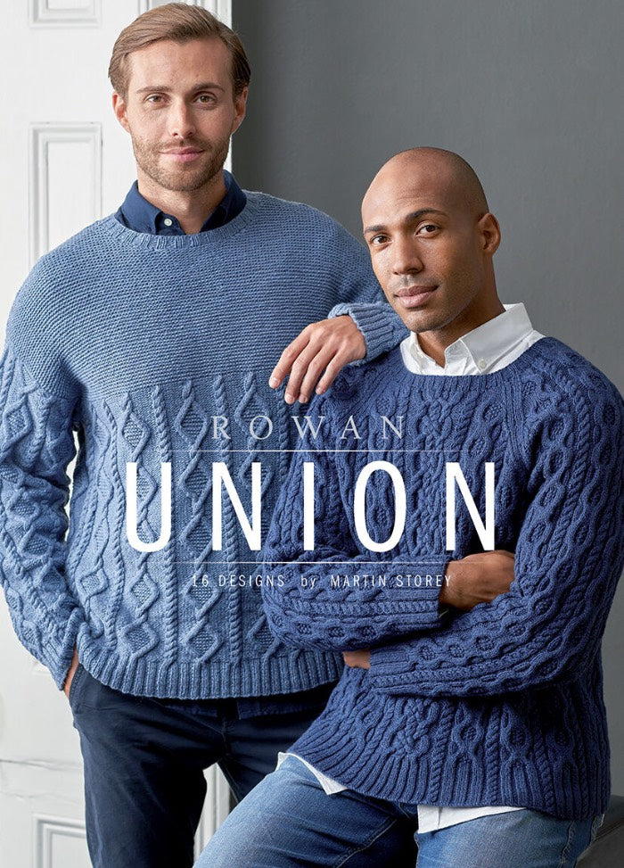 Two men in cozy knit sweaters featuring the word "Union" prominently displayed across the chest in bold lettering.
