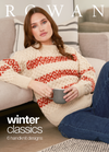 Woman in a cozy cream sweater with red patterns relaxes against a couch, holding a mug. Text reads "Rowan Winter Classics, 6 handknit designs."
