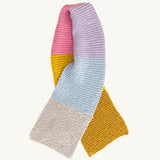 A multicoloured striped knitted scarf in the Brighton colourway